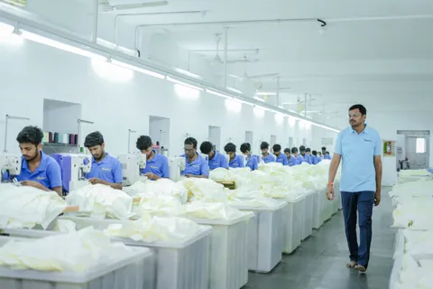 Expert inspecting fabric for quality assurance